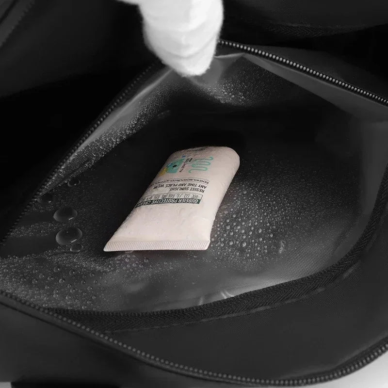 Small white tube of cream inside a black shoe with water droplets on the surface
