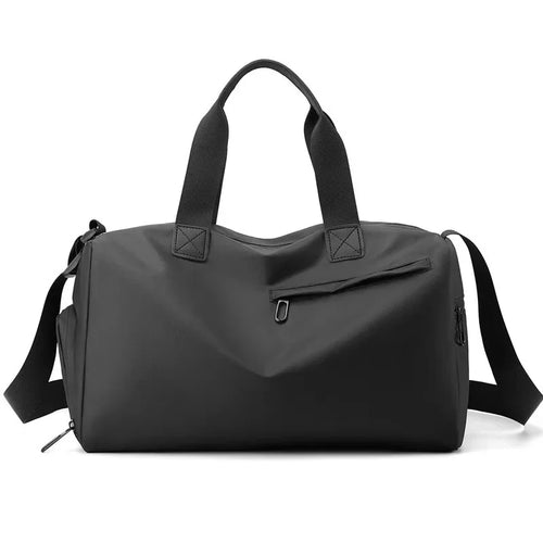 Black duffel bag with shoulder straps on a white background